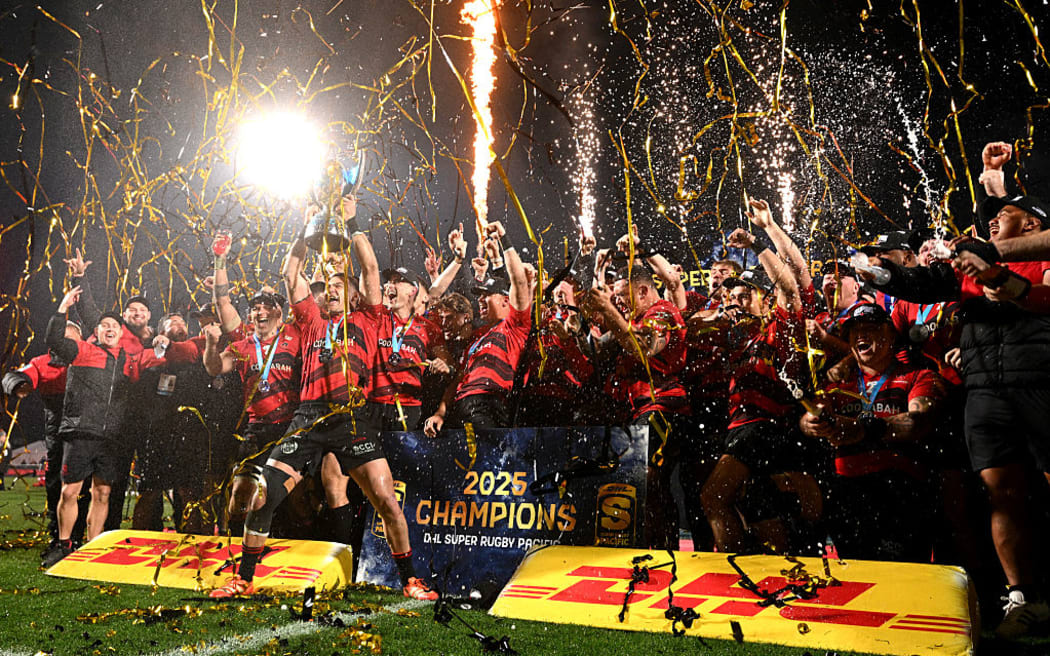 David Havili of the Crusaders and teammates celebrate with the Super Rugby Pacific trophy.