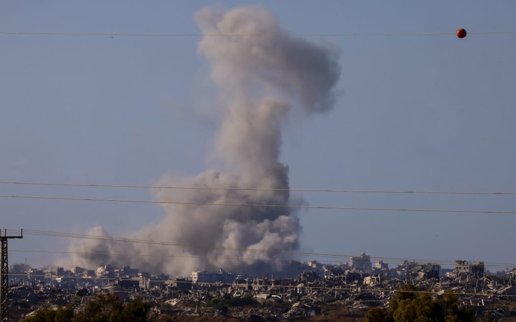 This picture taken from a position at Israel's border with the Gaza Strip shows smoke billowing amid Israeli bombardment of the besieged Palestinian territory on 16 September, 2025, amid the ongoing war between Israel and the Palestinian Hamas militant group.