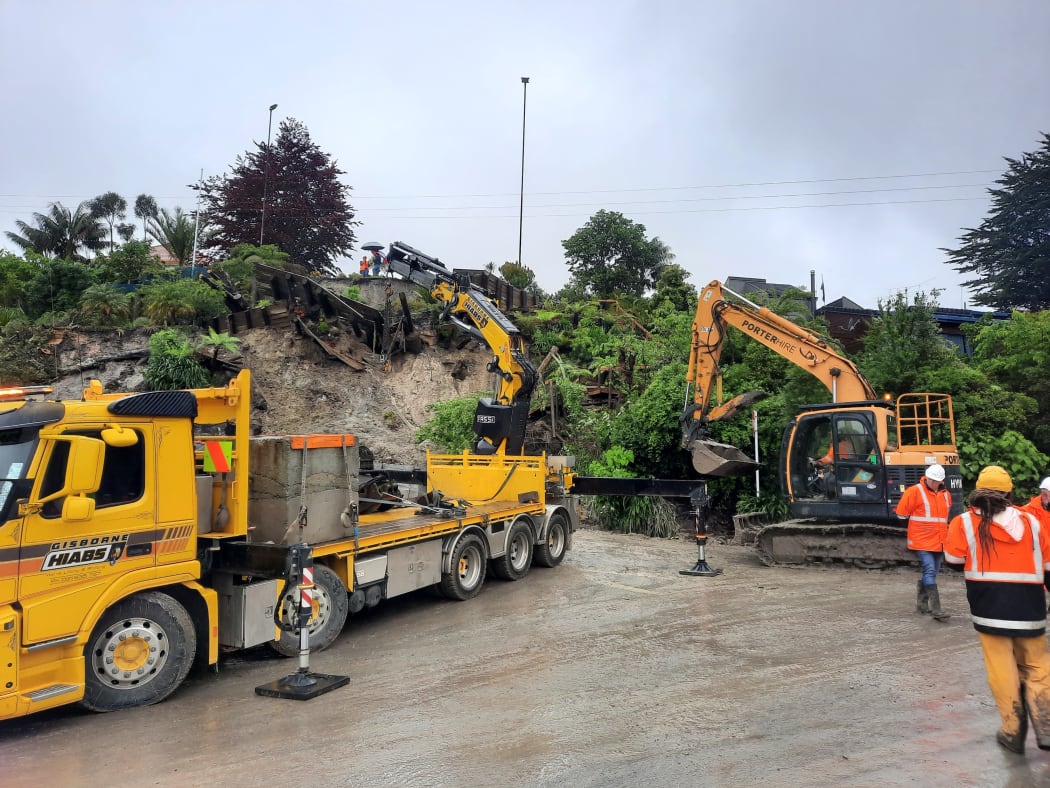 Contractors clean up a slip on Hill Rd in Gisborne.