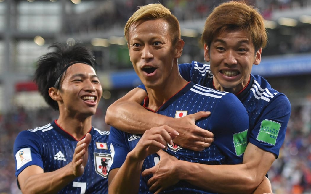 Japan's football team reach the last 16 at the FIFA World Cup after a yellow card countback.