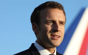 French President Emmanuel Macron speaks to the press upon his arrival at the airport in Noumea on May 3, 2018.