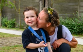 Emma Twigg and her family after winning silver in Paris. The Detail single use