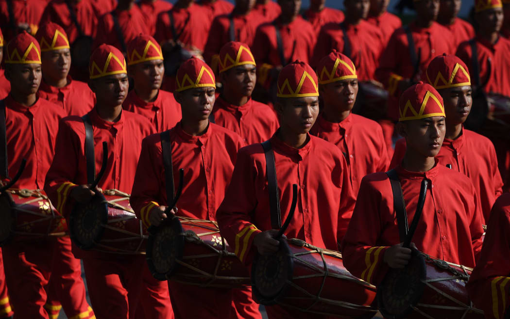 Attendants take part in the funeral procession.