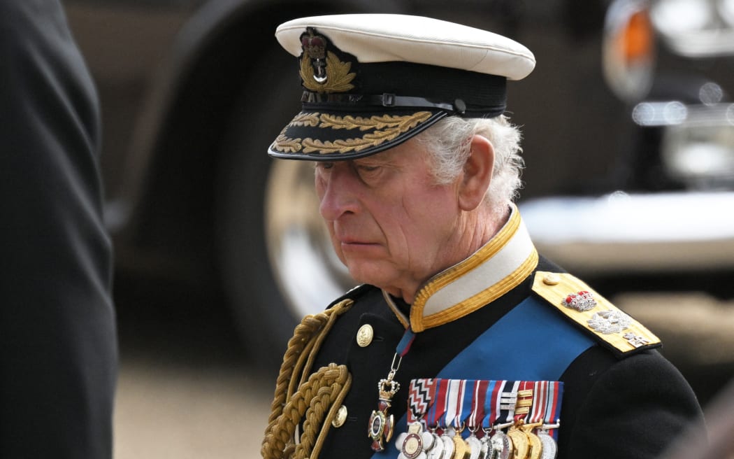 Britain's King Charles III follows the coffin of Queen Elizabeth II, as it travels on the State Gun Carriage of the Royal Navy, from Westminster Abbey to Wellington Arch in London on September 19, 2022, after the State Funeral Service of Britain's Queen Elizabeth II.