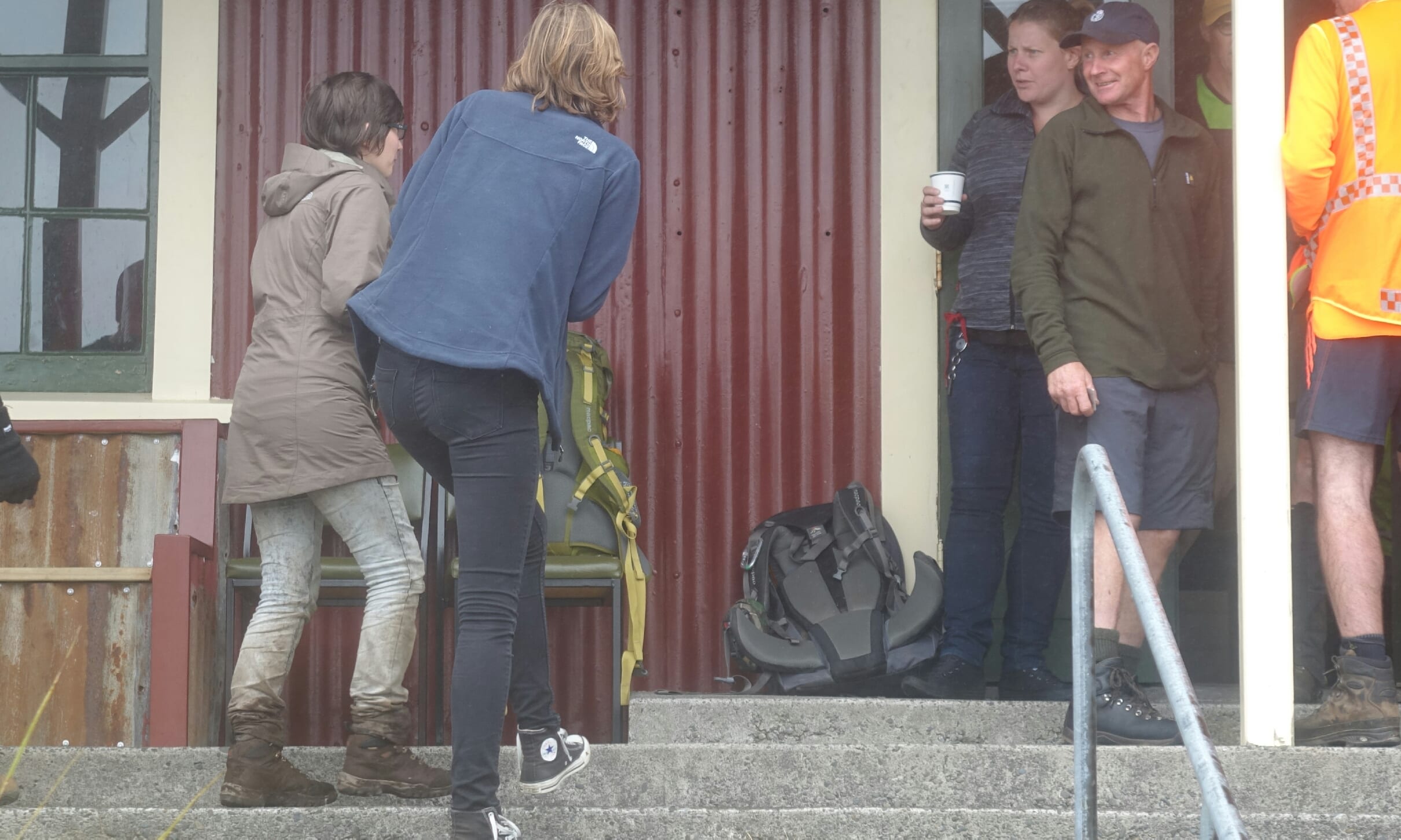 The missing woman, left, returns to the camphouse at North Egmont Visitors Centre.