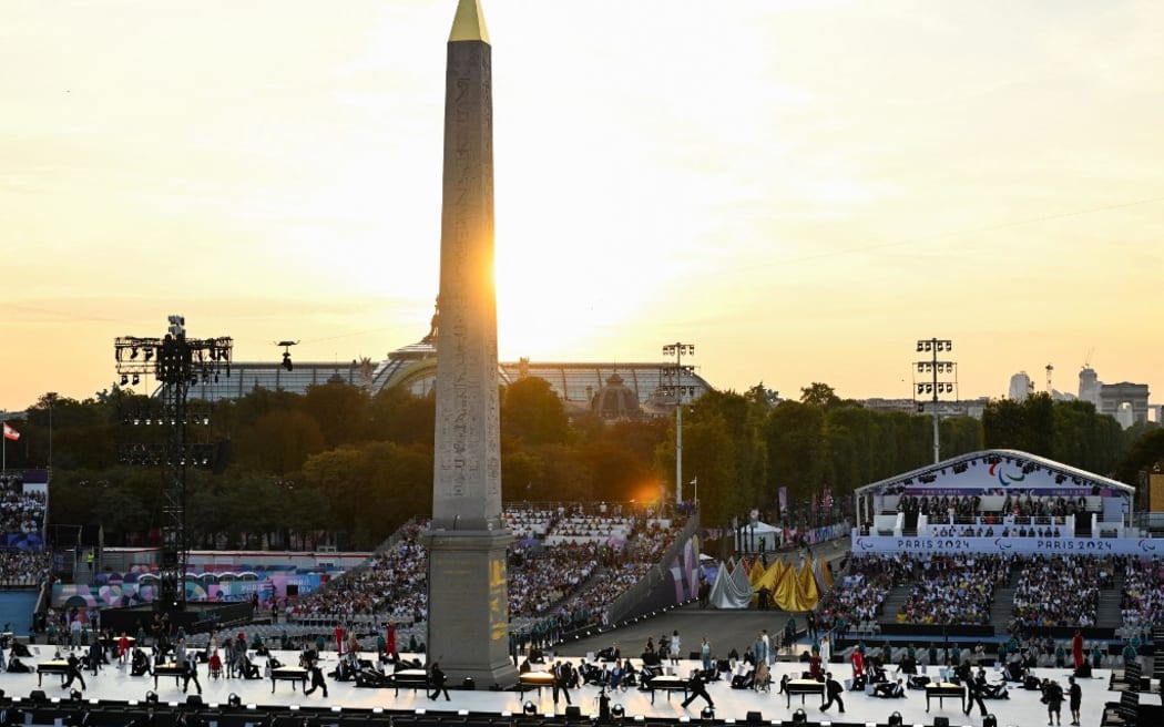 Dancers perform during the Paris 2024 Paralympic Games Opening Ceremony at the Place de la Concorde with the Obelisque de Louxor (Luxor Obelisk) in Paris on August 28, 2024. (Photo by Bertrand GUAY / AFP)