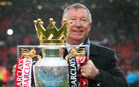 Manchester United manager Sir Alex Ferguson with the 2013 Premier League trophy