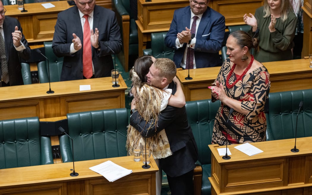 Prime Minister Chris Hipkins and former Prime Minister Jacinda Ardern embrace after Ardern's valedictory address.