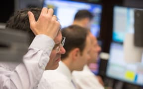 German stock traders watch as the market  is rattle by Chinese volatility.