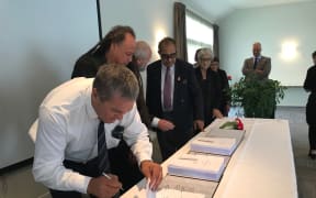Ngāti Hinerangi trustee Philip Samuels initialling the Ngāti Hinerangi Deed of Settlement in December