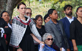 Prime Minister Jacinda Ardern holding hands with Titewhai Harawira as they are welcomed on to the Waitangi Treaty grounds.