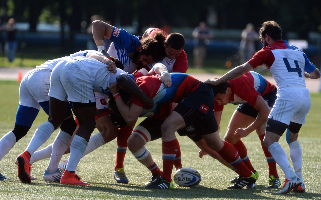 French players vie for the ball with Russia during the Rugby Seven's Grand Prix Series 2015 final.