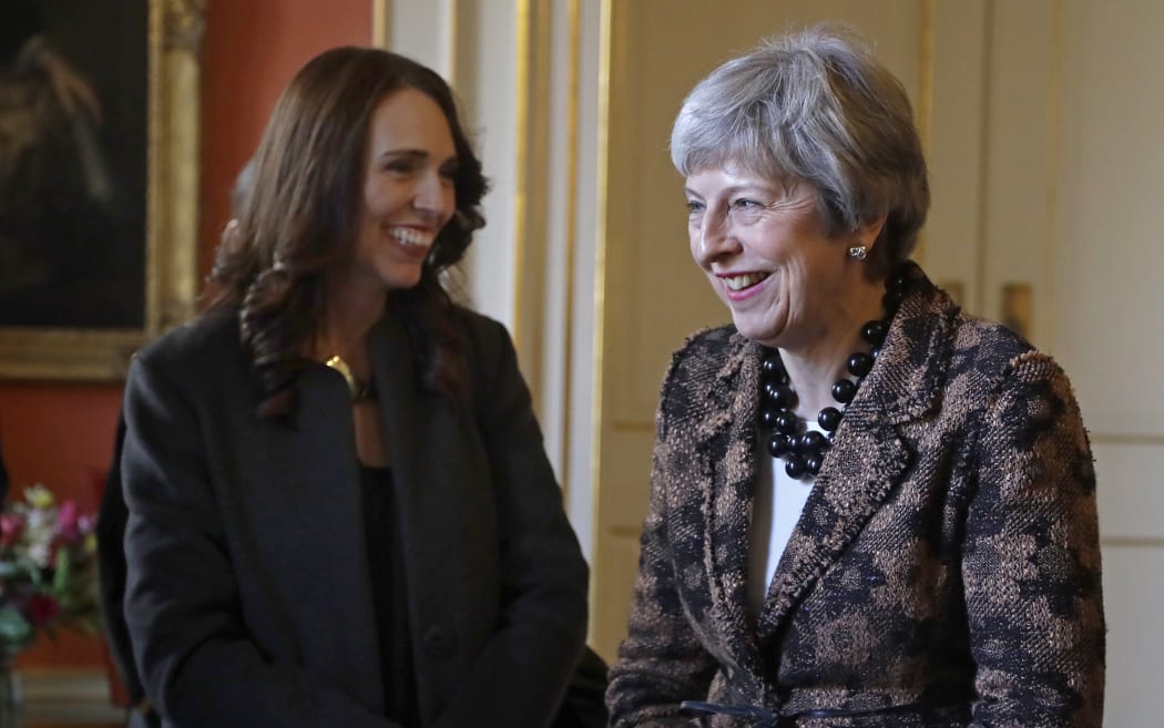 British Prime Minister Theresa May shares a joke with Prime Minister Jacinda Ardern inside 10 Downing Street.