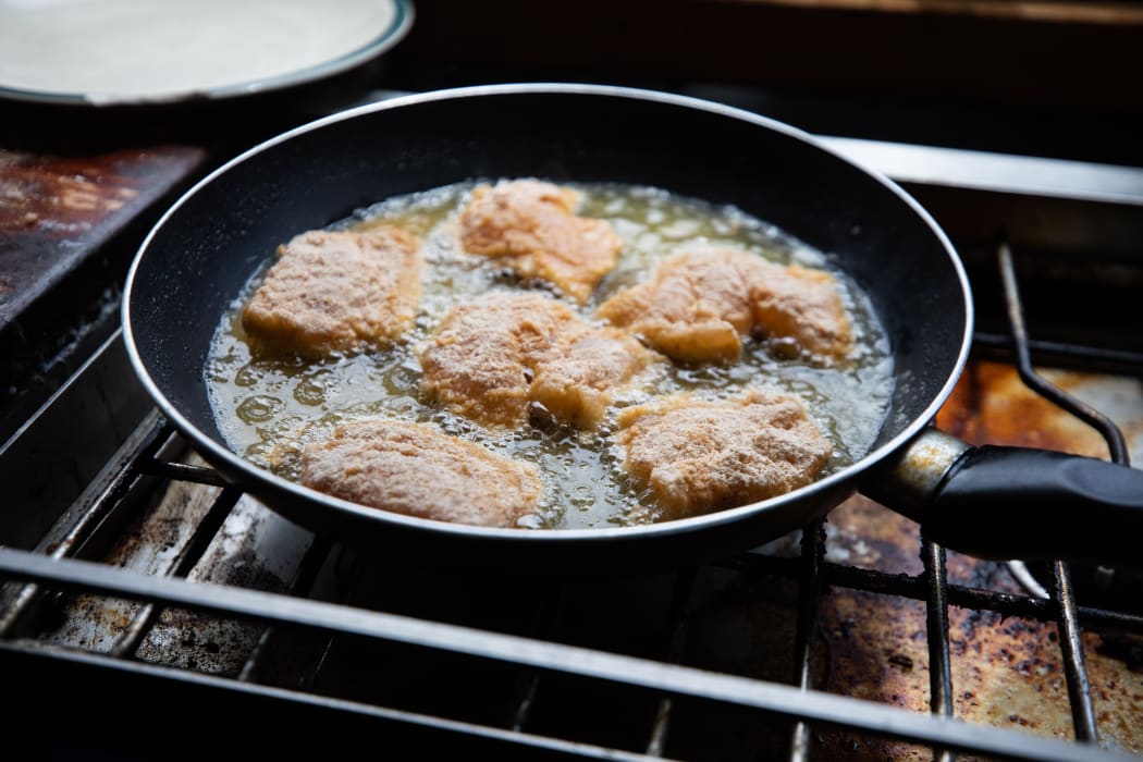 Snapper bites frying in pan.