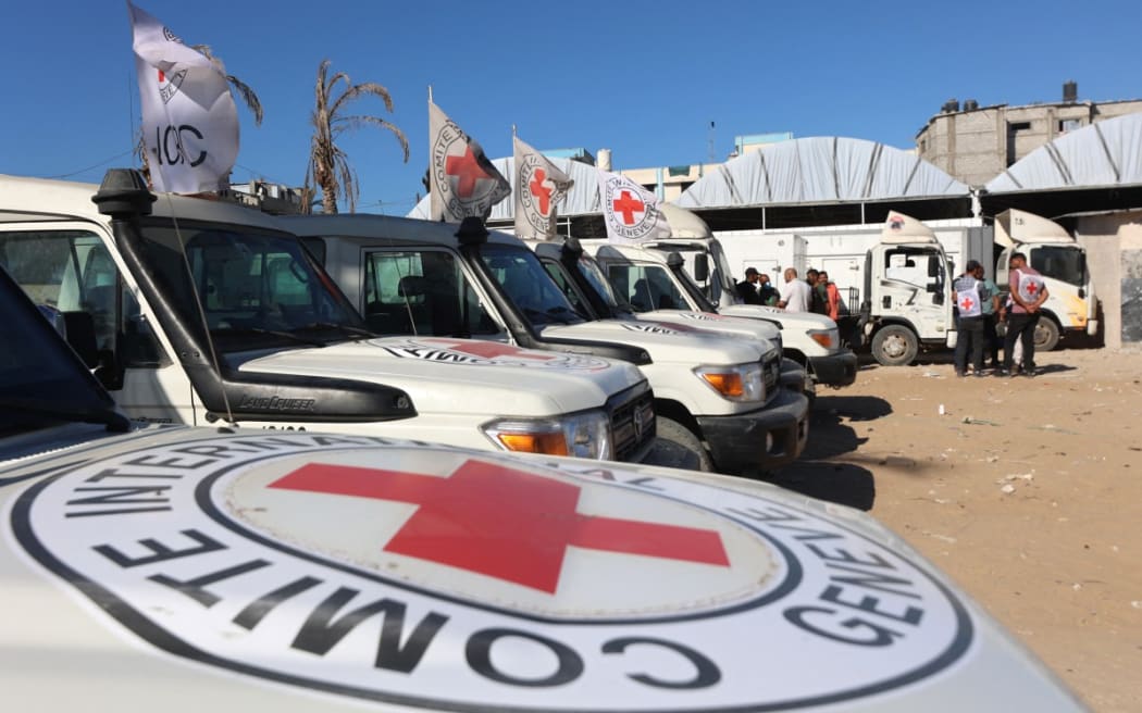 Red Crescent vehicles and refrigerated trucks are parked at the Nasser hospital in Khan Yunis in the southern Gaza Strip on October 15, 2025, after transporting the bodies of Palestinians that had been in Israeli custody.
