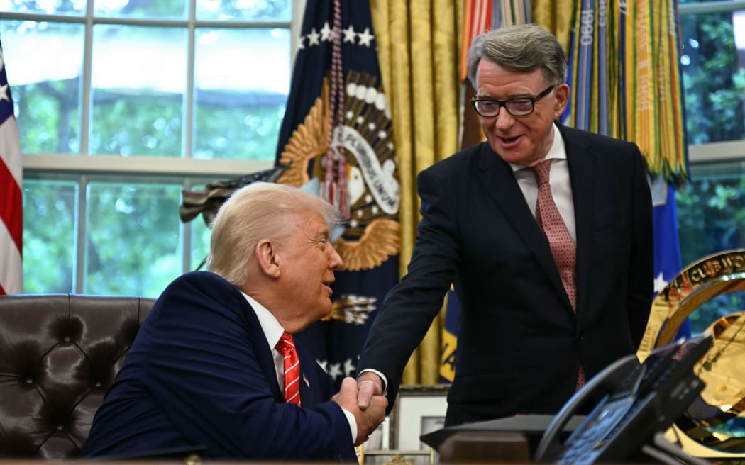 US President Donald Trump shakes hands with British ambassador to the United States Peter Mandelson  after making a trade announcement in the Oval Office of the White House in Washington, DC, on May 8, 2025. US President Donald Trump on Thursday announced a "full and comprehensive" trade agreement with Britain, which would be the first such deal since he launched his global tariffs blitz. (Photo by Jim WATSON / AFP)