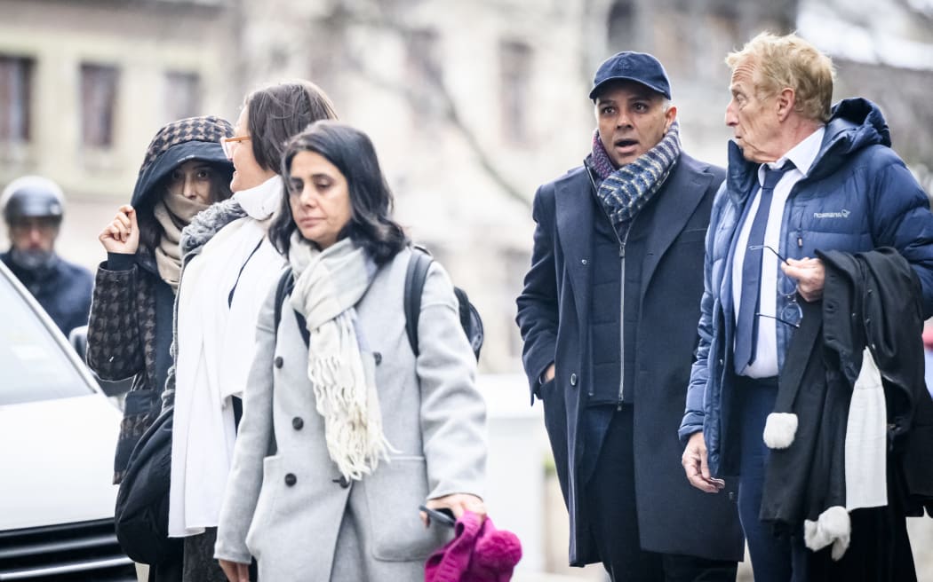 Indian-Swiss billionaire family members Namrata Hinduja (L) and Ajay Hinduja (2ndR) arrive at the Geneva’s courthouse with their lawyers Yael Hayat (C) and Robert Assael (R) at the opening day of their trial for human trafficking on January 15, 2024. The family has been accused of having employed several foreign servants without work authorization or residence permit, of having remunerated them in a terse manner by making them work without day off while retaining their passports and preventing them from leaving home. (Photo by GABRIEL MONNET / AFP)