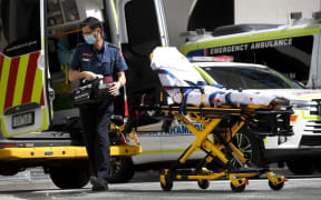 A paramedic prepares his ambulance in Melbourne on October 9, 2021, as Victoria state recorded 1965 new Covid cases, its highest daily infection number since the start of the pandemic, putting more pressure on the state's struggling health system.