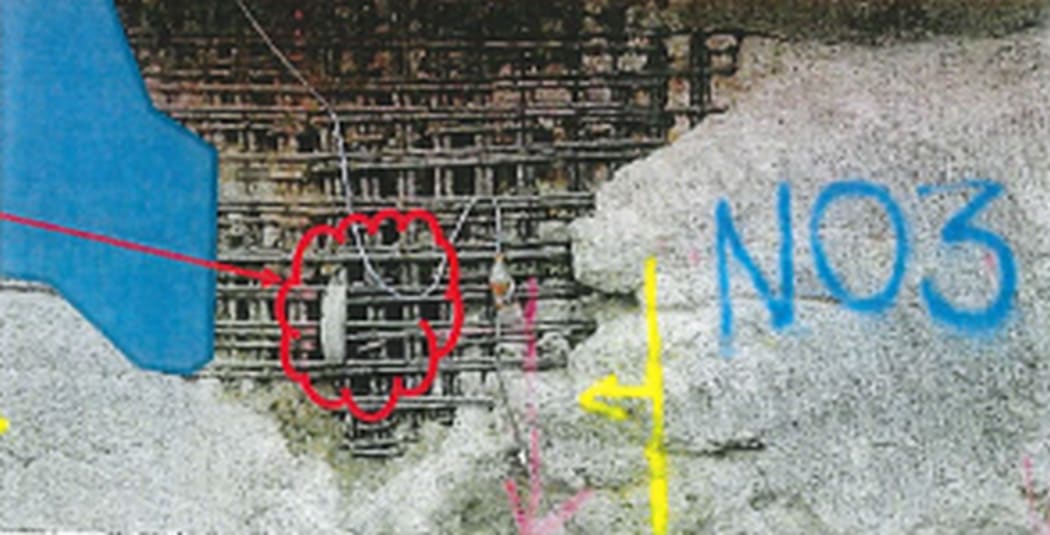Contamination of concrete and lack of cover exposes the reinforcing steel in the basement.