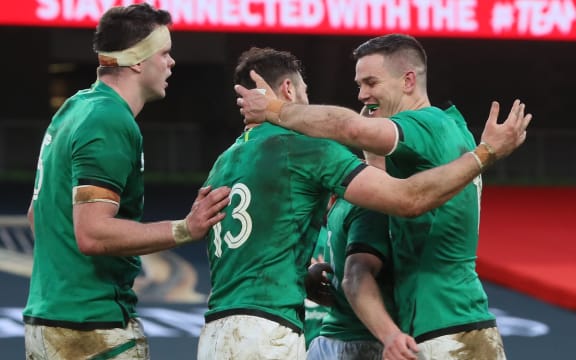 Ireland's fly-half Jonathan Sexton (R) and teammates celebrate their team's first try during the Autumn Nations Cup international rugby union match between Ireland and Scotland at Aviva Stadium in Dublin, on December 5, 2020.
