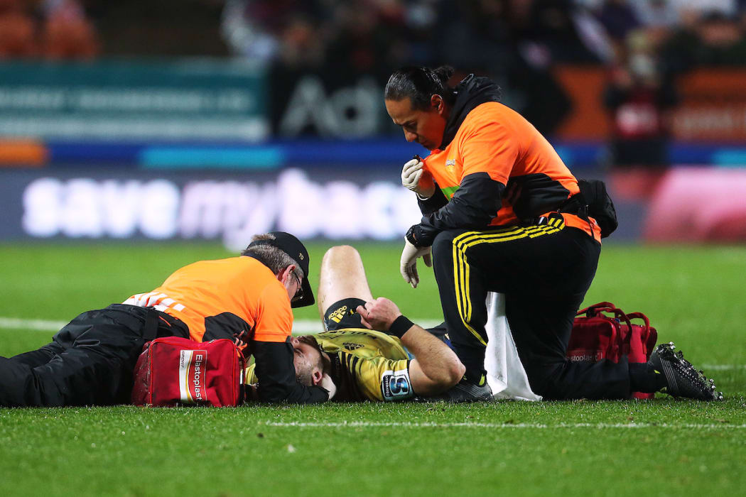Hurricanes centre Wes Goosen gets medical attention after a tackle from Chiefs second five Johnny Fa'auli on 13 July, 2018.