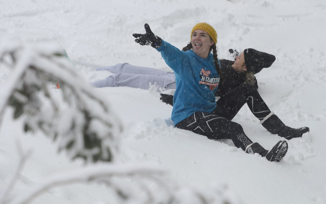 Tourists enjoy the snow at Falls Creek ski field, north of Melbourne.