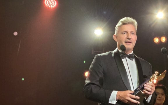 William McKegg receives the best short form prize at the 2024 Asian Academy Creative Awards in Singapore.