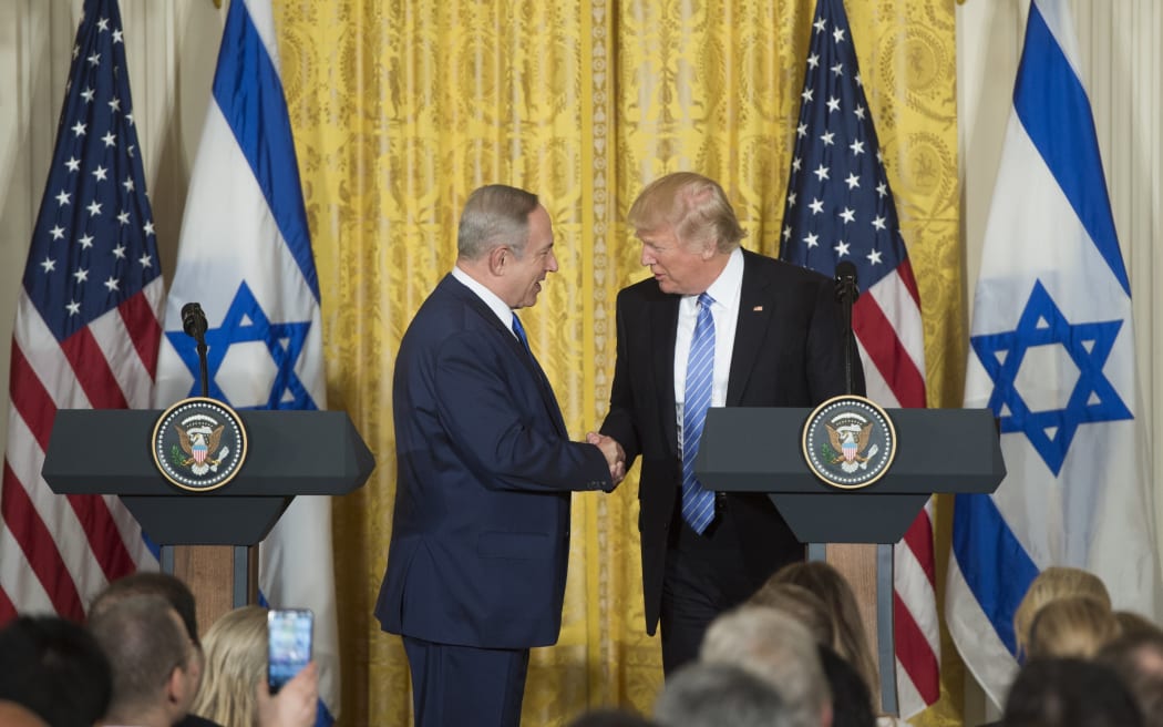 US President Donald Trump (R) and Israeli Prime Minister Benjamin Netanyahu hold a joint press conference in the East Room of the White House in Washington.