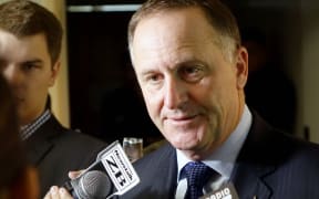 John Key speaking to media in Auckland.