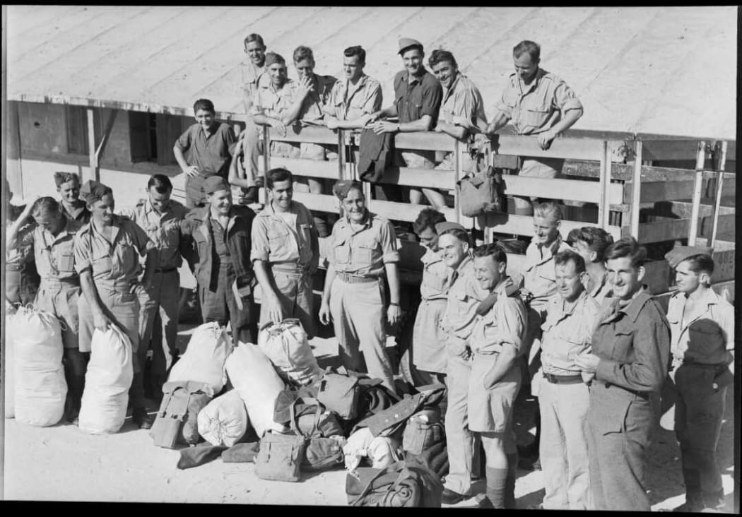 A group of repatriated New Zealand prisoners of war unloading their few belongings from a truck at Maadi Camp, Egypt, during World War II. These NZ POWs made their own way from Italian POW camps to connect with the British forces in southern Italy.
