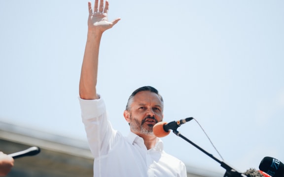 Green Party co-leader James Shaw responding to the demands from School Strike 4 Climate outside parliament on 26 January, 2021.