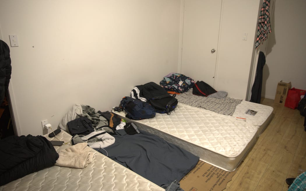 Mattresses lie on the floor of a room in a three-bedroom house in Papakura, Auckland, that is being used by more than 30 migrant workers.