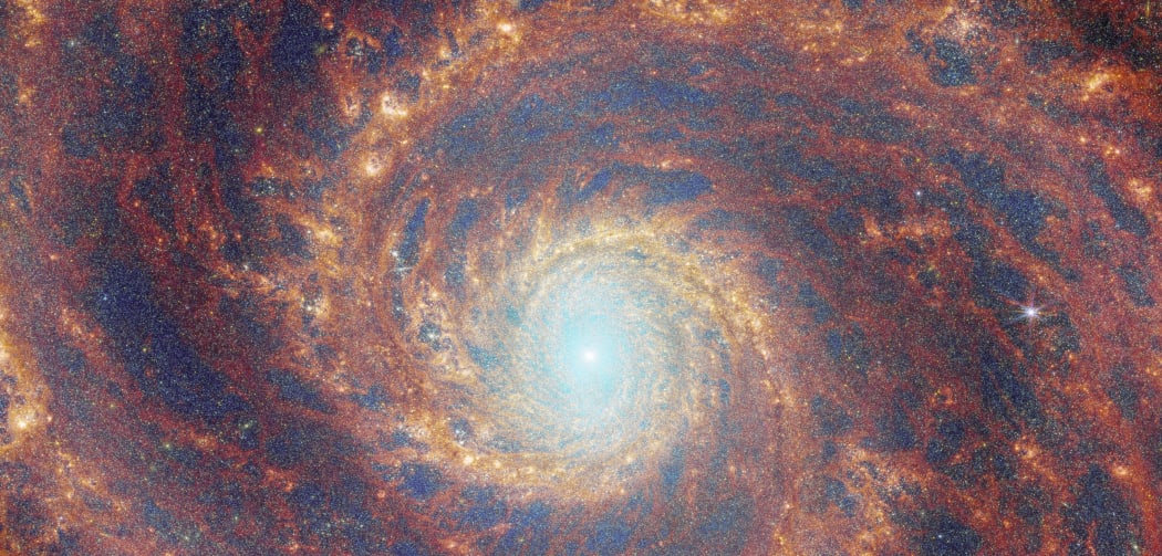 The M51 galaxy is called the Whirlpool due to its distinct spiral arms.