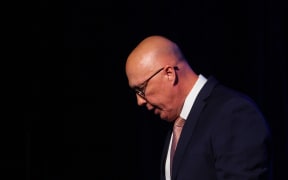 Australia's Opposition Leader Peter Dutton leaves the stage after conceding defeat in the general election at the Liberal Party election night event in Brisbane on May 3, 2025. Australia's right-leaning opposition leader Peter Dutton conceded defeat in a general election on May 3, saying he had spoken to Prime Minister Anthony Albanese. (Photo by Patrick Hamilton / AFP)