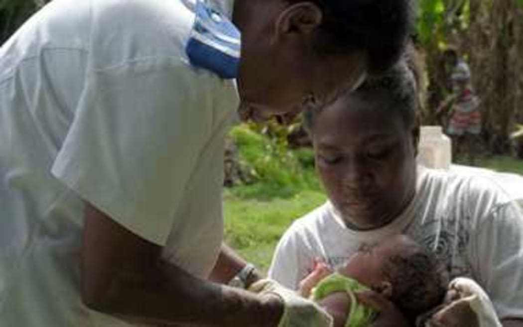 Registered nurse, Miriam Nampil, 55 years, vaccinates the first baby with a commercial drone delivered vaccine. Baby Joy Nowai, one month old, receives vaccines BCG to prevent tuberculosis and Hepatitis B.