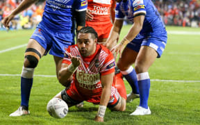 Konrad Hurrell celebrates a try for Tonga.