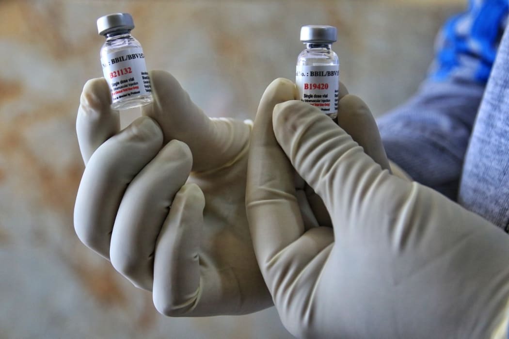 A medic show used bottles of COVID-19 vaccines  during the Bharat Biotech's 'Covaxin' human trial after it was approved by the Indian Council of Medical Research (ICMR), at Maharaja Agrasen Super Speciality Hospital in Jaipur, Rajasthan,India, Friday, Dec. 18, 2020.