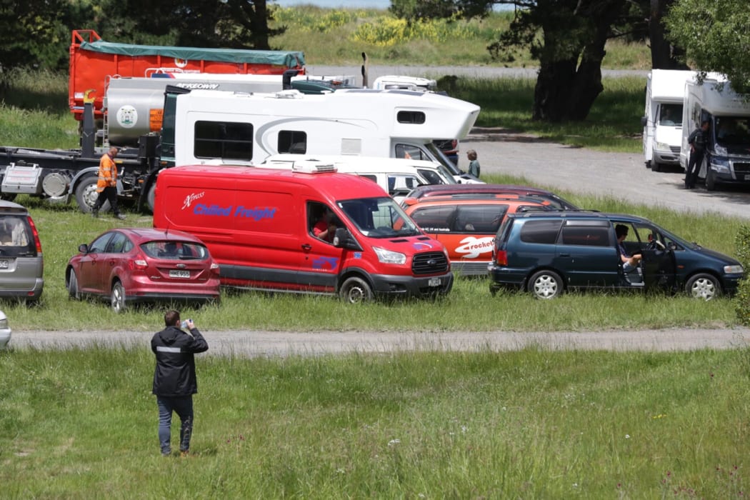 Dozens of people wait to be allowed to travel out of Kaikoura on the inland route.