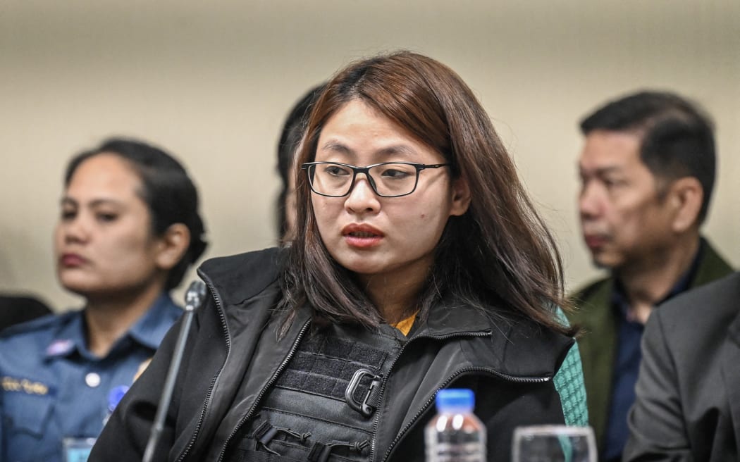 (FILES) This file photo taken on September 9, 2024 shows Alice Guo, former mayor of Bamban in Philippines' Tarlac province, attending a hearing at the Senate in Manila over accusations of human trafficking and links to Chinese organised crime. A Philippine court on November 20, 2025, sentenced Alice Guo, a Chinese national who became a mayor while masquerading as a Filipina, and seven others to life in prison on human trafficking charges. (Photo by Jam STA ROSA / AFP)
