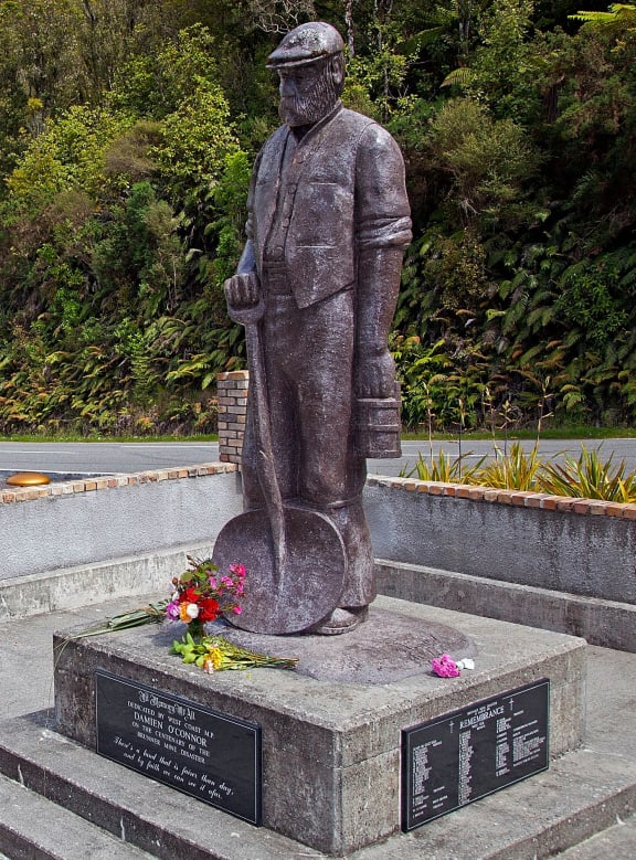 Flowers left at a statue of a miner near Pike River at the time of the diaster.