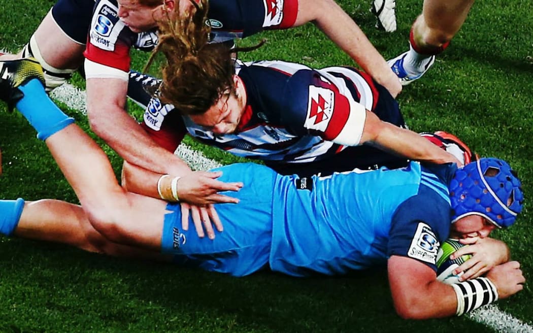 James Parsons of the Blues scores a try.