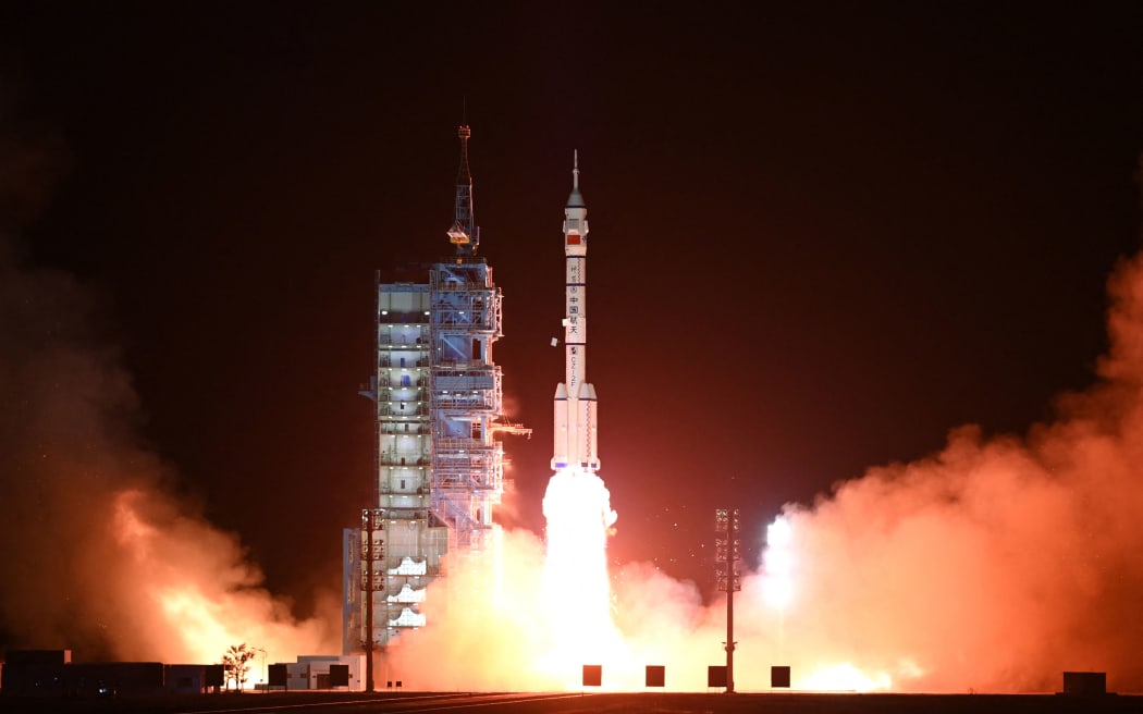 A Long March-2F carrier rocket, carrying the Shenzhou-15 spacecraft with three astronauts to China's Tiangong space station, lifts off from the Jiuquan Satellite Launch Center in Northwest China’s Gansu Province late on 29 November 2022. - China launched the Shenzhou-15 spacecraft on November 29, 2022 carrying three astronauts to its space station, where they will complete the country's first-ever crew handover in orbit, state news agency Xinhua reported.