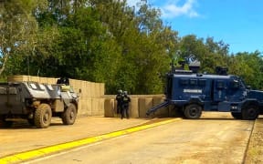 French security forces armoured vehicles posted in the outskirts of Nouméa