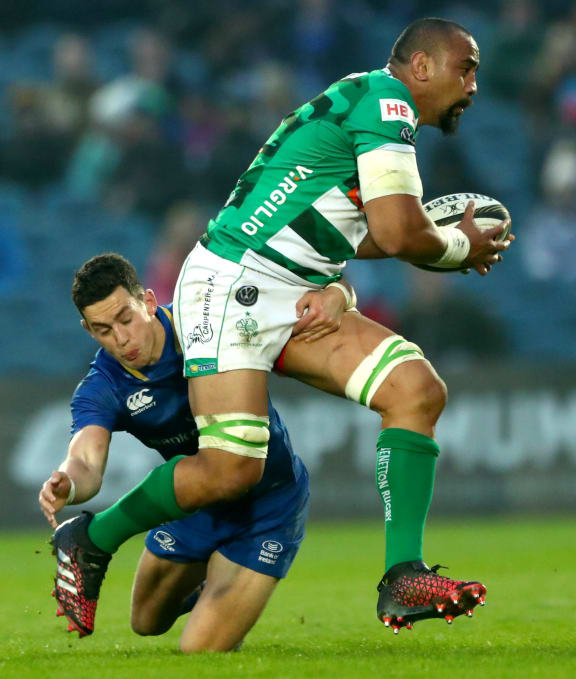 Benetton Treviso's Nasi Manu attempts to evade the tackle of Leinster's Noel Reid.