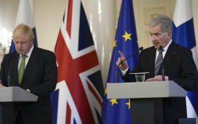 British Prime Minister Boris Johnson and Finnish President Sauli Niinisto address a press conference at the Presidential palace in Helsinki, Finland.