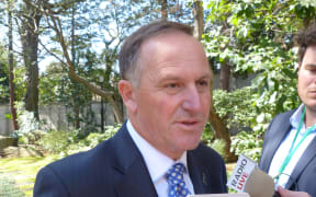 Prime Minister John Key talking to reporters in Japan in Wednesday