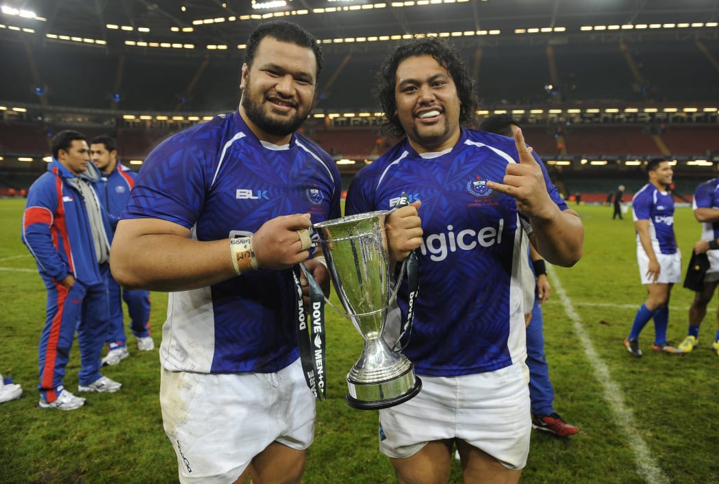 Brothers James and Census Johnston celebrate Samoa's win over Wales in 2012.