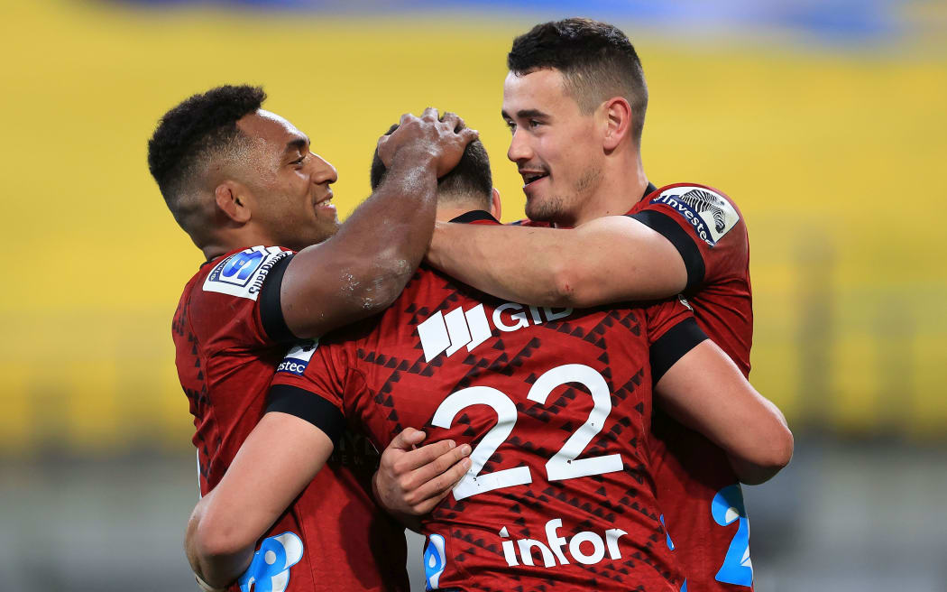 Crusaders David Havili celebrates his try with team mates Sevu Reece and Will Jordan.