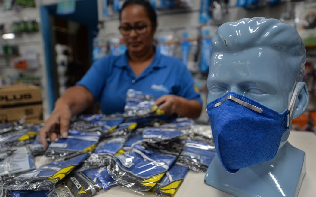A worker at a medical supply store organizes PFF-2 respirator mask that customers are buying as a precaution against the spread of the new coronavirus, the COVID-19, in Sao Paulo, Brazil, on February 27, 2020.
