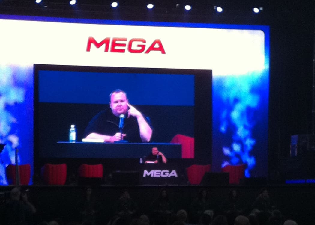 Kim Dotcom holds a news conference at Sunday's launch party.